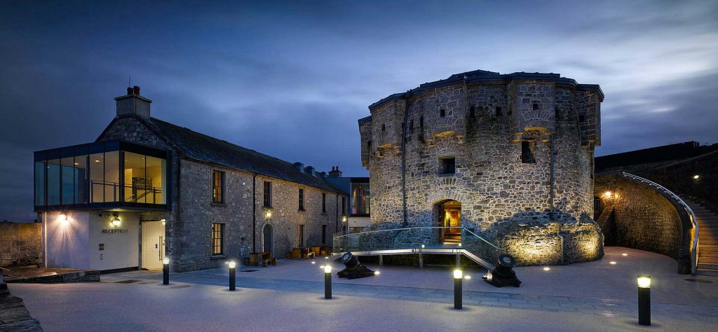 The old castle keep in the courtyard beautifully lit up on a dark evening at Athlone Castle Visitor Centre.