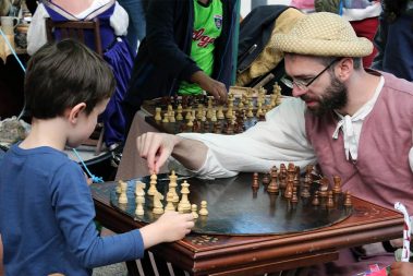 A young learner and a medieval chess master having an intense game of chess during our Annual Medieval Fair at Athlone Caslte Visitor Centre.