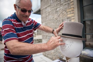 Athlone Castle volunteer Thomas Evans demonstrating is barber skills during Heritage Week. Here Thomas uses a blown up balloon wearing a top hat to see show just how delicate a process this job is.