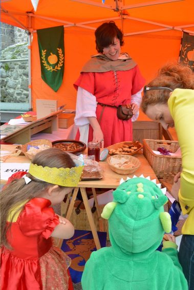 Some children dressed up as a princess and a dragon checking out one of the many stalls at Athlone Castle’s Annual Medieval Fair where many treats and goodies can be found.