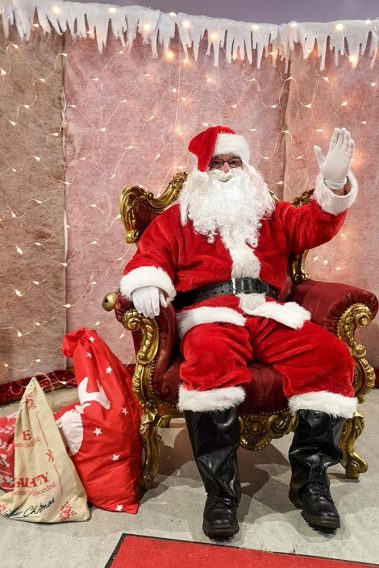 Santa Clause visits Athlone Castle Visitor Centre at Christmas. Here he sits in his chair, wearing his traditional red Santa suit and black boots with his long white beard. He waves wishing everyone a Happy Christmas. I wonder what gifts are in his Christmas sacks placed next to him?