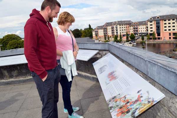 A couple reading about Athlone Castle location and history from our information boards on the upper battlements all while taking the wonderful views of the town itself
