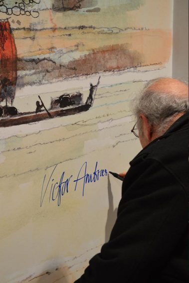 Artist Victor Ambrus adds his signature to one of his many illustrations on the walls at Athlone Castle Visitor Centre.
